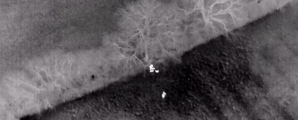 Thermal infrared image of landscape with bright white heat signatures