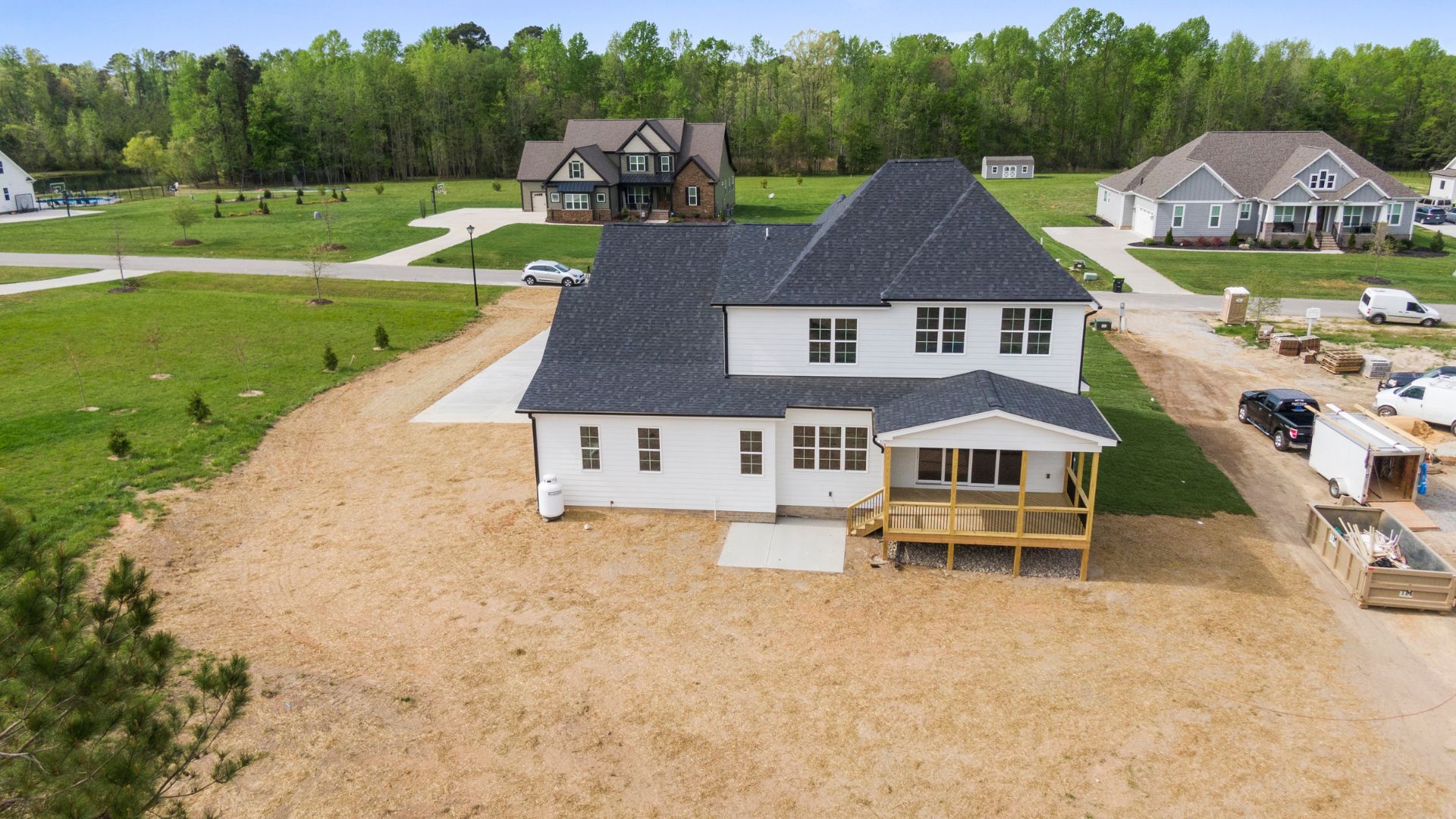 Aerial view of white house under construction in new suburban neighborhood